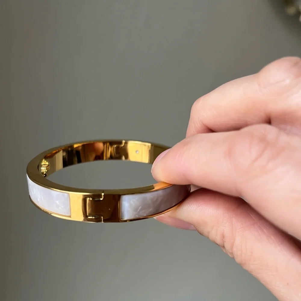 KATE SPADE PUNCH HOLE BANGLE BRACELET IN PEARLY WHITE - Picture 3 of 4